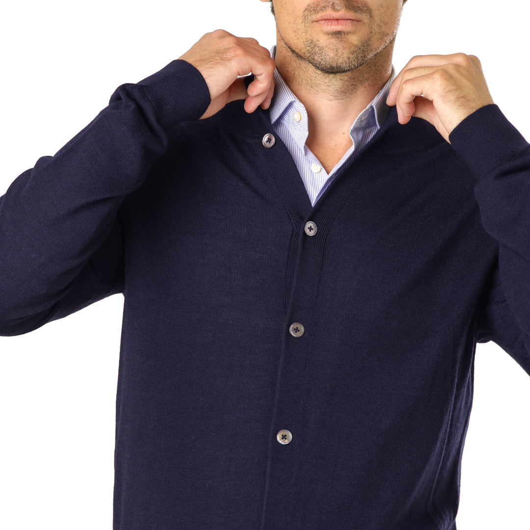 Detail shot of the navy Merino Cardigan’s breathable fabric and classic button detailing.