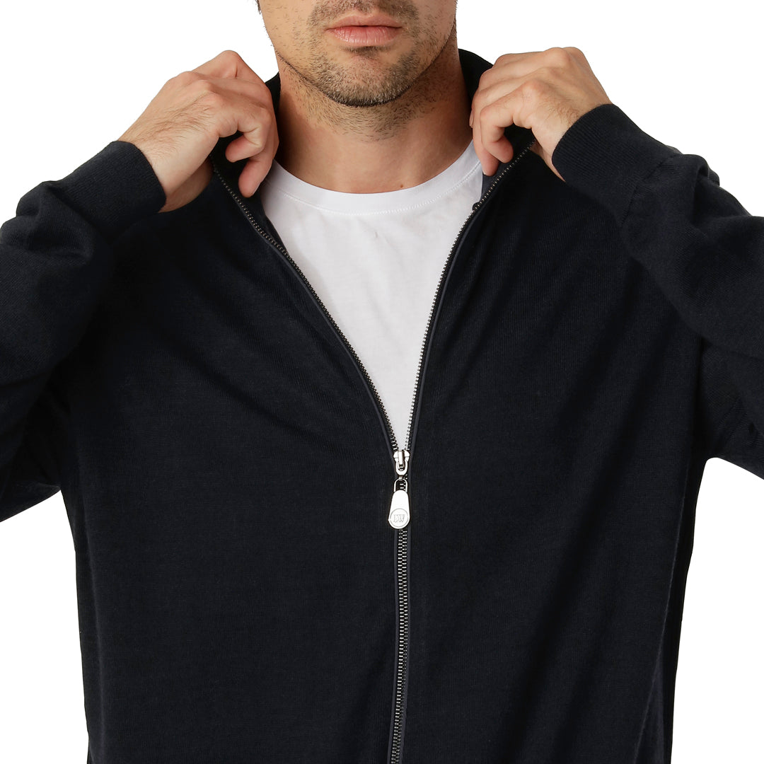 Close-up of the navy Zip Cardigan’s full-zip closure and fine merino wool blend fabric texture.