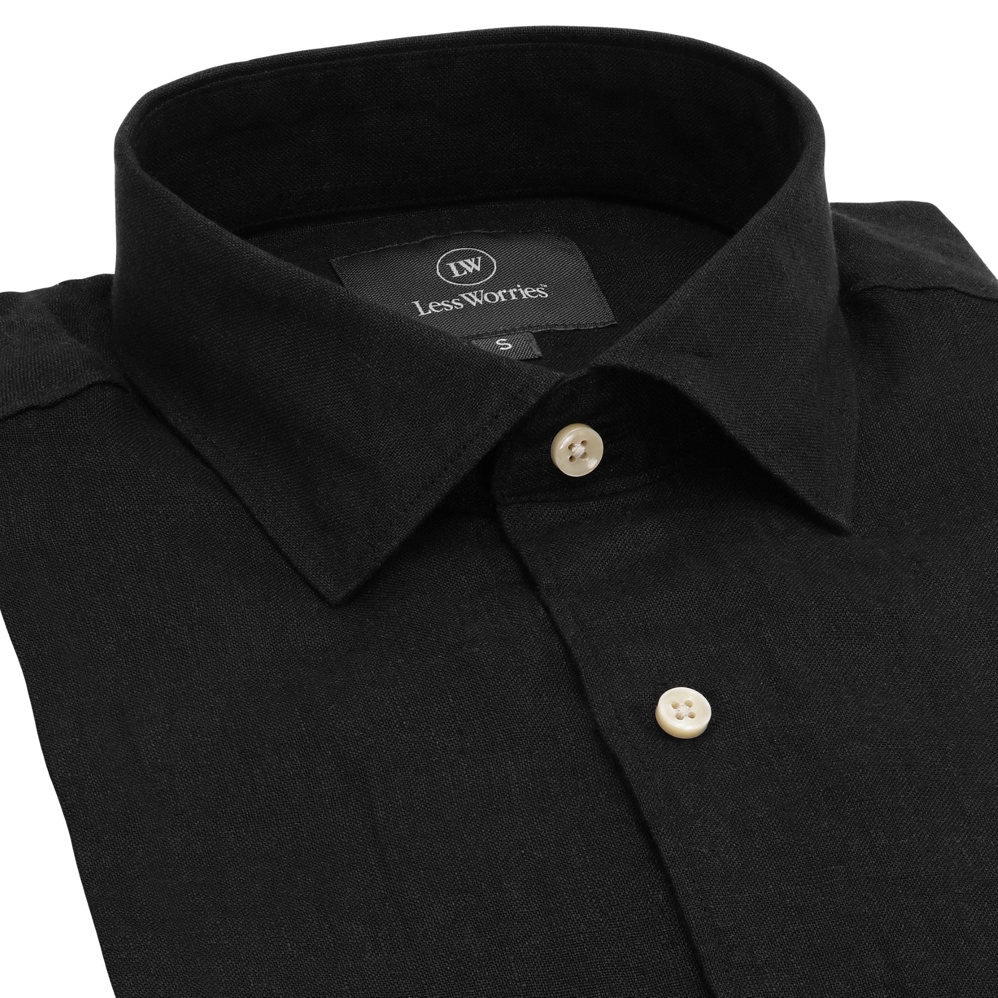 Black linen shirt with white buttons.